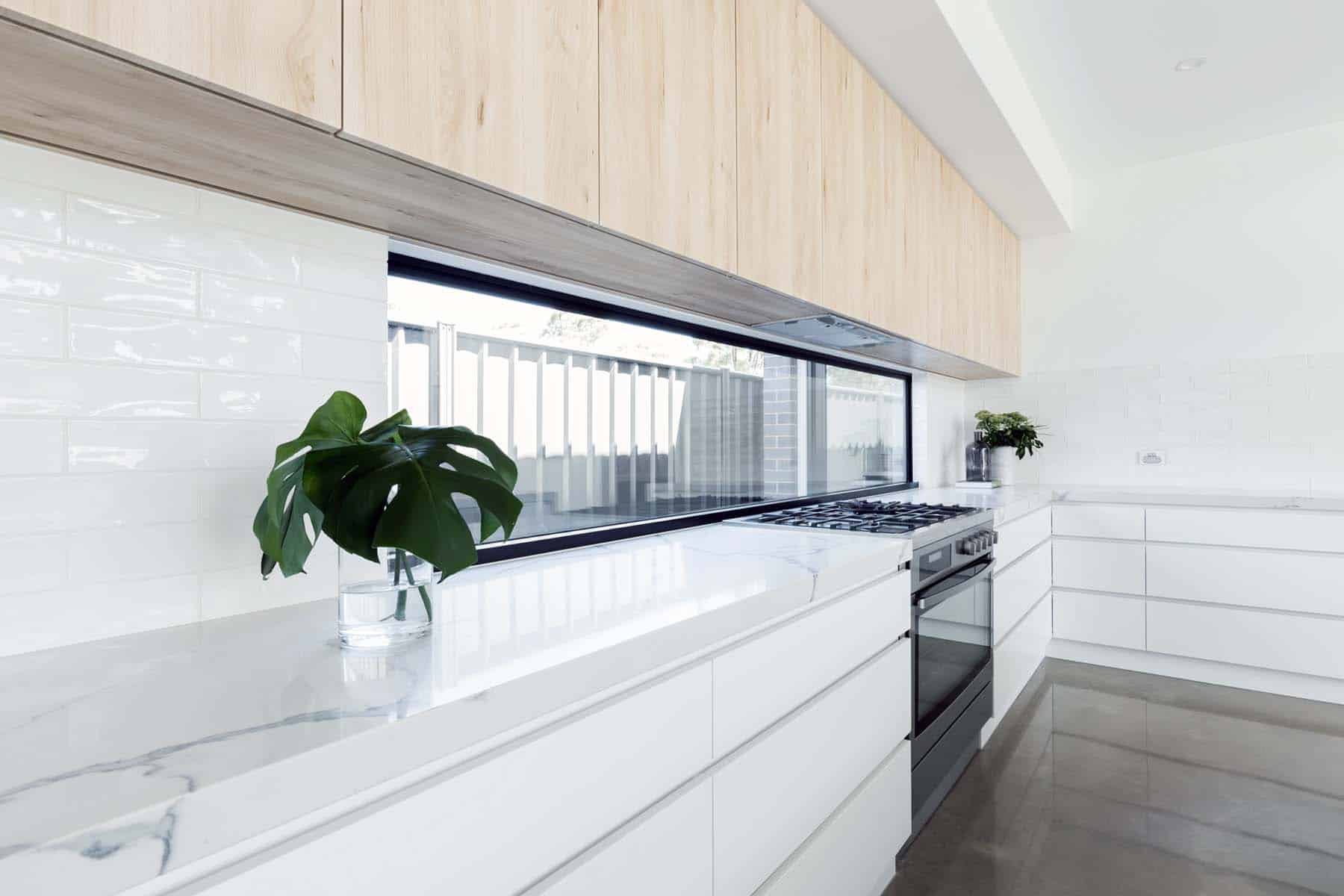 Modern luxury kitchen with window splashback